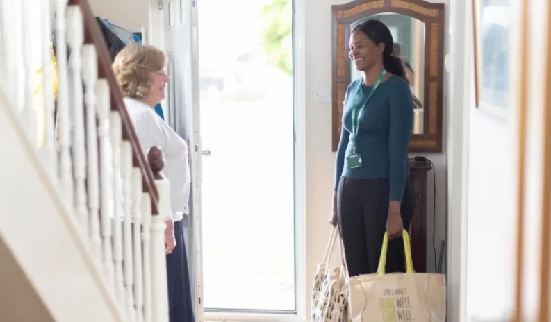 Care professional supporting an older adult at home in Richmond and Wandsworth with personalised visiting care.